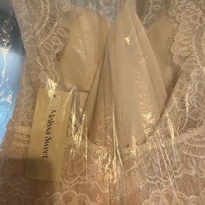 Wedding dress. Brand new. Still has the tags on it and original bag. Never worn.